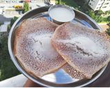 A picture of step 9 of Appam with coconut milk.