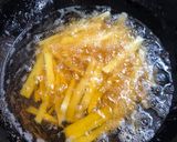 A picture of step 1 of Cheesy fries on the stove.