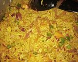 A picture of step 5 of Chinese fried rice with coleslow and fry meat.