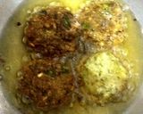 A picture of step 5 of Dahi vada (lental dumpling) is a popular India chaat.