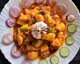 A picture of step 16 of Khatay aloo.