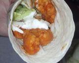 A picture of step 5 of Buffalo chicken strip wrap.