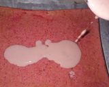 A picture of step 7 of Strawberry milk cake with whipped cream frosting.