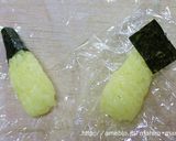 A picture of step 3 of Pokemon Character Bento - Pikachu Onigiri.
