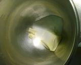 A picture of step 2 of Professional cinnamon rolls topped with cream cheese icing.