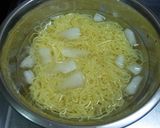A picture of step 3 of Cold Tonkotsu Ramen with Dipping Sauce.