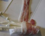 A picture of step 2 of Japanese-style Enoki Mushrooms and Hanpen Fish Cake Wrapped with Sliced Pork.