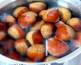 A picture of step 1 of Our Family Recipe for Chestnuts Simmered in Their Inner Skins.