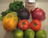 A picture of step 1 of Papaya Avocado and Tomato Salad.