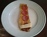 A picture of step 6 of Eggplant Pizza Roll Ups.