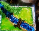 A picture of step 10 of Blackforest jungle theme cake.