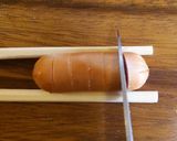 A picture of step 1 of Bear & Flower Bento with 1 Wiener Sausage.