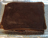 A picture of step 8 of Cocoa Crepe Roll Cake with Whole Strawberries.