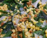 A picture of step 4 of Corn and rajas (pepper strips).