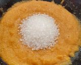 A picture of step 4 of Rava kesari with dessicated coconut and toasted sesame.