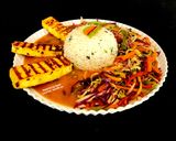 A picture of step 5 of Spicy Grilled Paneer Steak Italian Herb Rice Schezwan Sauce With Exotic Sautéed Veggies Gourmet Meal.