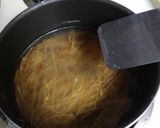A picture of step 2 of Fried Anglehair and Eggs.