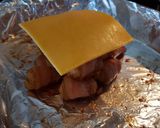 A picture of step 9 of Cheesy bacon wrapped tots.