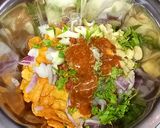 A picture of step 5 of Beguni ghoti gorom.