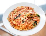 A picture of step 8 of Spanish omelet with spinach and cheese.