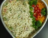 A picture of step 5 of Cheesy Maggi vegetable cake.