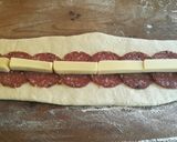 A picture of step 2 of Cheese and Salami centred bread..
