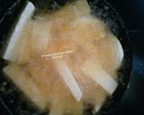 A picture of step 3 of Fried plantain,yam with scrambled eggs.