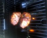A picture of step 6 of Tinklee's BBQ Bacon Wrapped Stuffed Pork Chops.