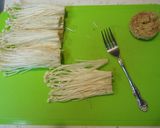 A picture of step 3 of How to Brush-Clean and Freeze Enoki Mushrooms.