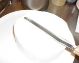 A picture of step 12 of The Trick to Making a Beautiful Decorated Cake.