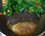 A picture of step 6 of Butter-Sautéed Spinach with Caramelized Soy Sauce.