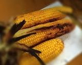 A picture of step 10 of BBQ Corn on the Cob with Husks.