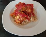 A picture of step 3 of My chilli +Garlic Meatballs on top of spaghetti.