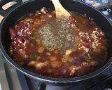 Une image de l'étape 15 de Dahl de lentilles jaunes aux carottes violettes, tomates et courgette.