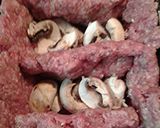 A picture of step 3 of Mushrooms stuffed in meat loaf.