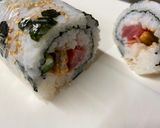 A picture of step 7 of Mickey Mouse Roll Sushi.
