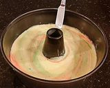 A picture of step 10 of Peppermint Chiffon Cake with a Chocolate Ganache Glaze.