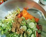 A picture of step 2 of Spicy cabbage, carrot and cucumber pickle.