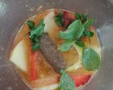 A picture of step 2 of Fruit sangria.