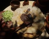 A picture of step 8 of Oaxacan Tlayudas.