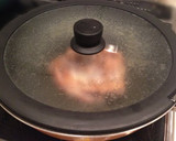 A picture of step 13 of Authentic Garlic Chicken in a Frying Pan.