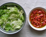 A picture of step 2 of Delicatessen-Style Lettuce and Tomato Salad.
