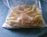 A picture of step 4 of Extra Crispy Spicy Hand Cut Fries.