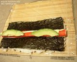 A picture of step 4 of How to Roll an Inside-Out Sushi Roll (California Rolls).