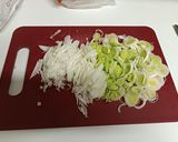A picture of step 1 of Garlic Soup with Caramelized Onion, Leek, and Goat Cheese.