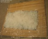 A picture of step 3 of How to Roll an Inside-Out Sushi Roll (California Rolls).
