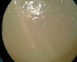A picture of step 3 of Cheesy cornbread in a cast iron pan.