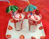A picture of step 6 of Strawberry milk shake with dollop of strawberry ice cream.