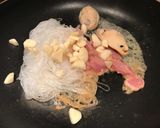 A picture of step 2 of Super Healthy Cellophane noodles with shrimps mussels pork fried vegetables.
