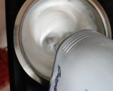 A picture of step 2 of Tiramisu with whipping cream.